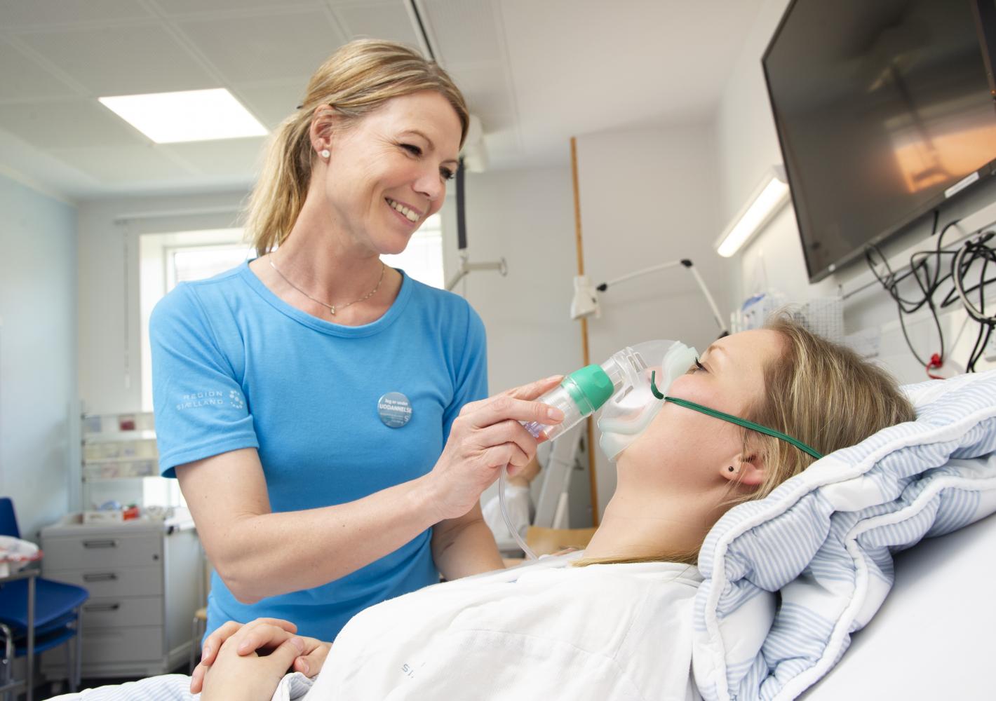 Nursing student with patient